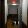 Second floor hallway view of interior stairway