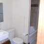 bathroom pedestal sink and large mirrored medicine cabinet bathtub shower
