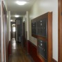 first floor hallway mailboxes across from side entry door a