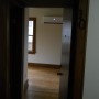 view of apartment entry door from building hallway