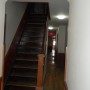 view of stairway to second floor from front door entry area