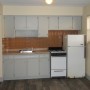 kitchen supplied with gas stove oven, refrigerator