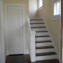 stairway to second floor and closet inside front entryway
