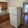 white Frigadaire 18 cubic foot refrigerator in kitchen b