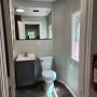 view into bathroom from kitchen doorway b