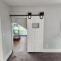 view into laundry room from inside bedroom