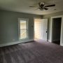 view of entry door and hallway from inside living room