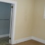 view of bathroom door from bedroom