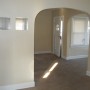 view of entry door through dining room