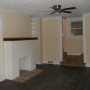 view of decorative fireplace in living room from front door