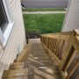 view down exterior stairway from entry door landing
