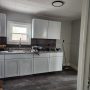 view into kitchen from bathroom doorway