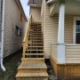view up exterior stairway from front yard